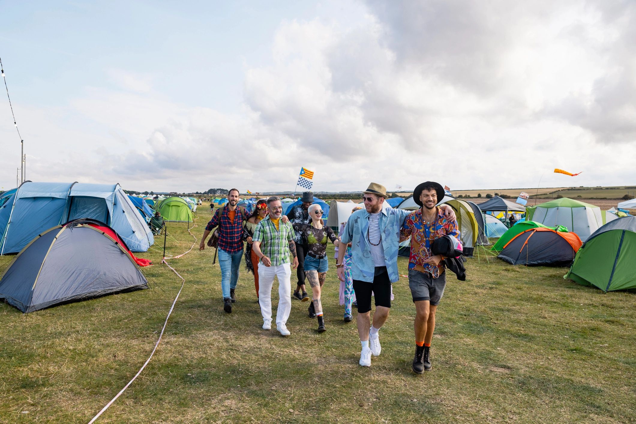 Festival-goers walking toward a community music area